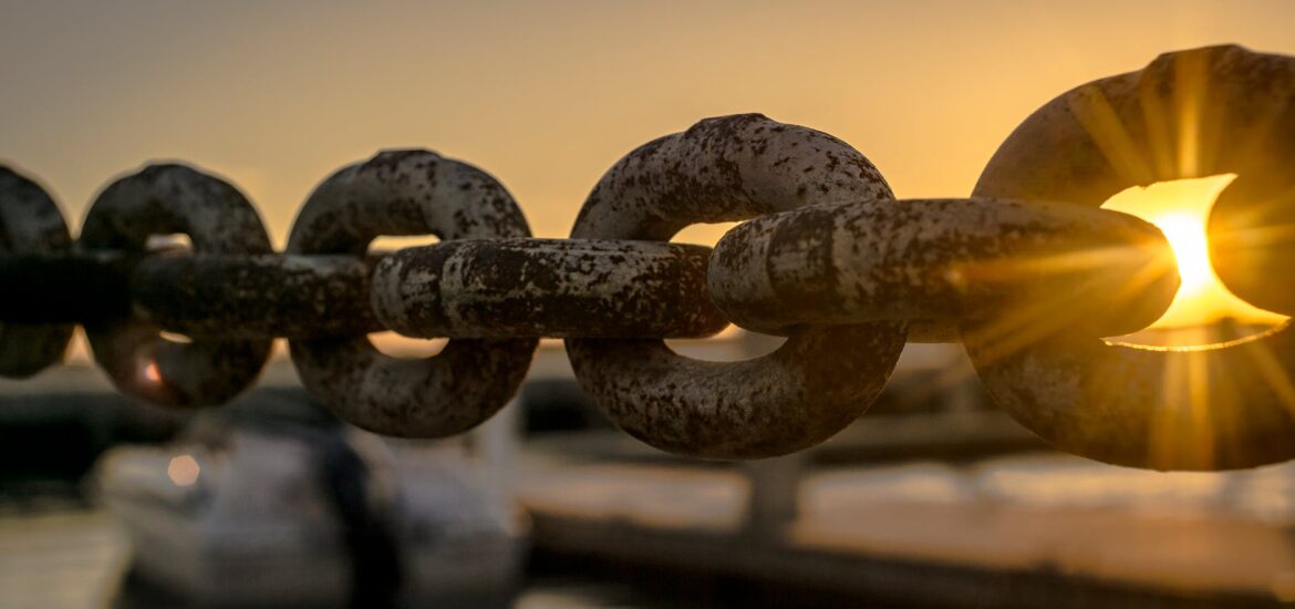selective focus photoraphy of chains during golden hour